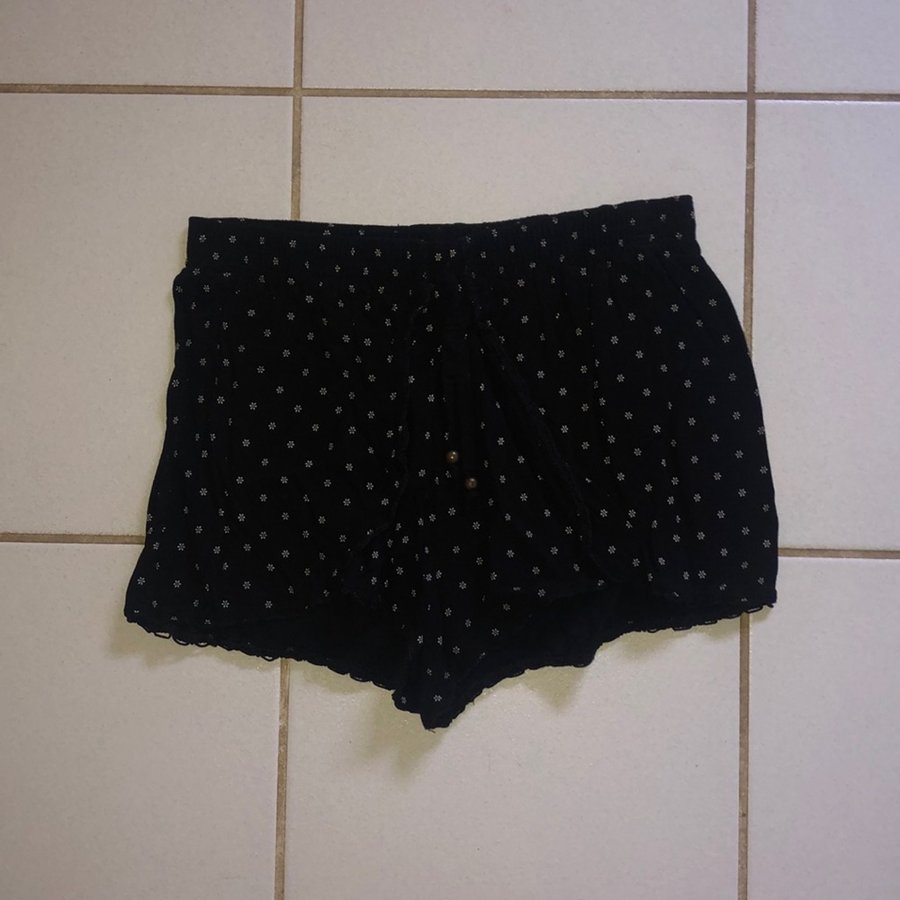 Boho mini black shorts with white floral design